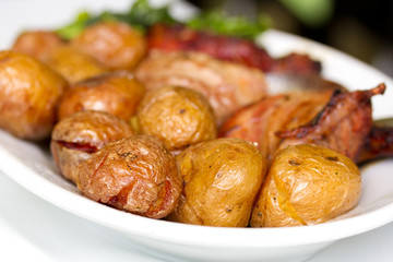 turkey with potato and greens on white plate