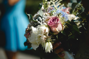Bride with luxury bouquet of roses