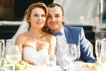 Young beautiful stylish smiling newlyweds