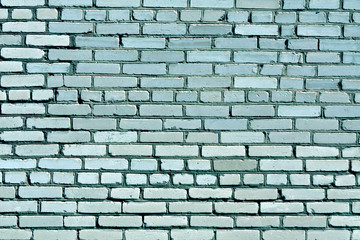 Fototapeta premium Weathered cyan toned brick wall texture.