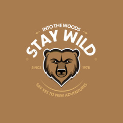 Stay Wild Bear Head print for t-shirt or apparel. Old school graphic for fashion and printing. Retro artwork with outdoor theme, elements and typography. Isolated vector illustration.