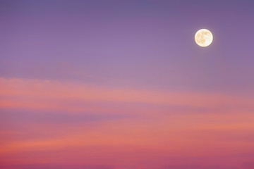 full moon with sunset clouds
