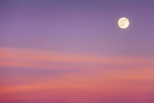 Fototapeta full moon with sunset clouds