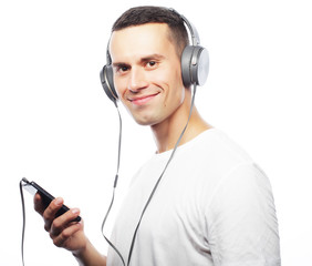 life style and people concept:Young man enjoying music on his he