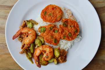 fried fish cake and spicy stir fried bitter flat bean with shrimp on rice