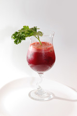 glass with vegetable cocktail and ice