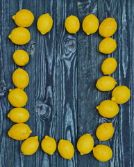 Fototapeta na wymiar wooden background with lemons