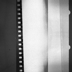 Obraz premium Camera filmstrip negative background texture (black and white)