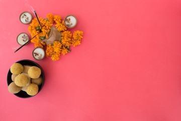 Hindu festival of lights, Dusshera and Diwali preparation and celebration ingredients- sweets, flowers, lights, cash, bell and splash cymbals and incense sticks