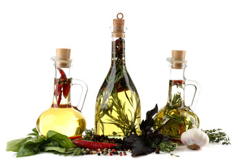 Obraz na płótnie Canvas Olive oil with spices, isolated on white