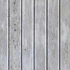 square part of wooden fence or wall with old bladdered gray pain