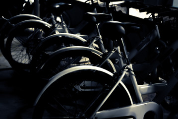 Fototapeta na wymiar White Bicycle Soft focus in parking on Dark tone