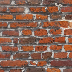 very old square part of red brick wall