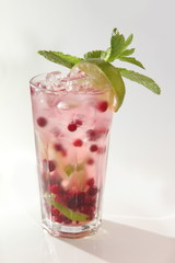 cold cocktail with ice and cranberries