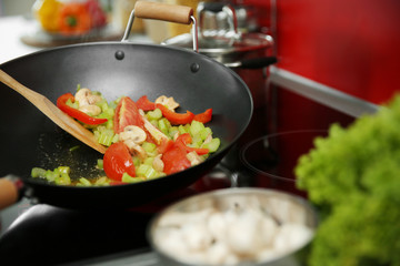 Mixing vegetables in pan closeup