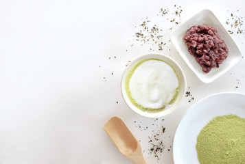 green tea latte on white table background. over light