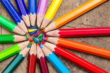 Naklejka premium beautiful wooden crayon on wood