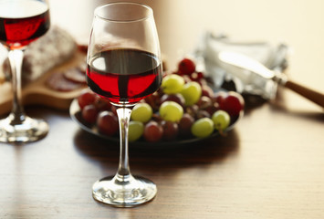 Glasses with wine on served table