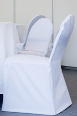 Fototapeta na wymiar chairs with white fabric cover for celebrations