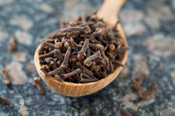 cloves in a wooden spoon