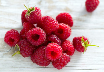 raspberries on wooden surface