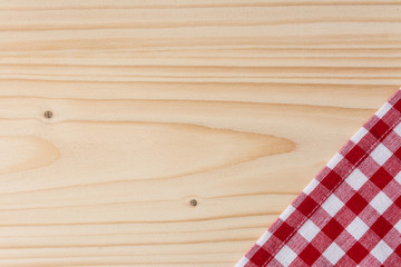 Checkered tablecloth red on the wooden background/ texture 