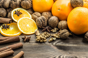 Christmas setting with seasonal spices and fruits.