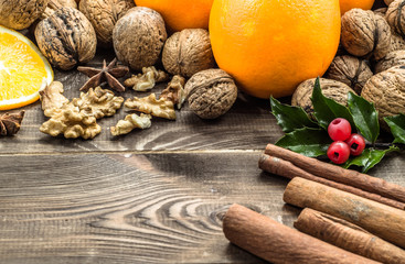 Christmas setting with seasonal spices and fruits.