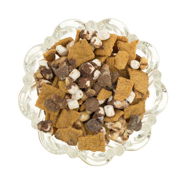 Smores candy mixture in a glass bowl top view isolated on a white background.