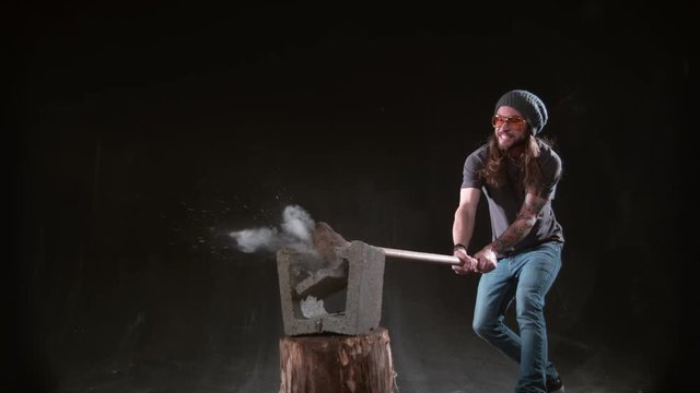 Man smashing cement block with hammer in slow motion, shot on Phantom Flex 4K at 1000 fps
