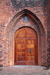 Fototapeta na wymiar Beautifully restored massive double wood door entrance to the Karmeliter monastery in Elsinore Denmark