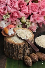 White sesame seeds organic on wood background.