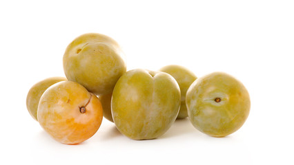 green plum isolated on white