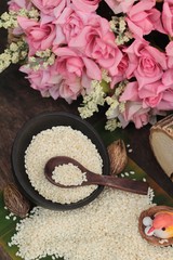 White sesame seeds organic on wood background.