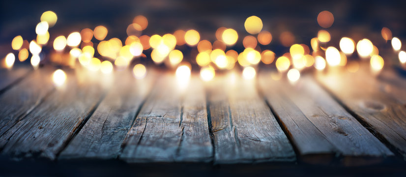 Bokeh Of Christmas Lights On Vintage Wooden Plank
