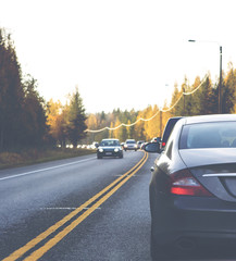 A huge traffic jam on an asphalt road. Image has a vintage effect applied.