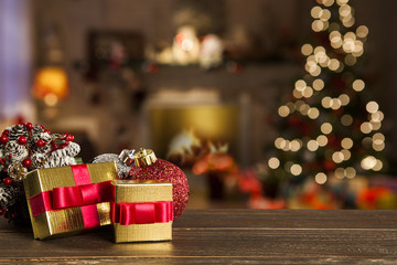 Christmas background with Christmas tree on wooden table. Red, golden and silver ornaments.