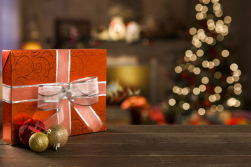 Christmas background with Christmas tree on wooden table. Red, golden and silver ornaments.