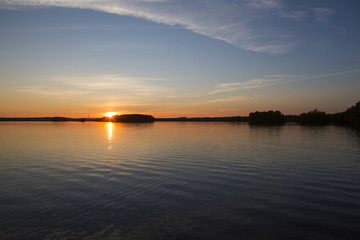 Fototapeta na wymiar Calm evening at the lake during sunset.