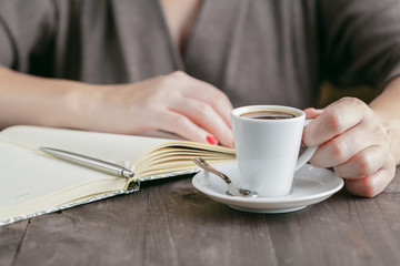 Woman drinking espresso