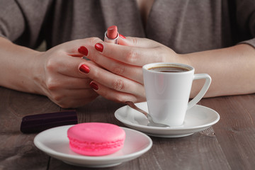 woman ready to rouge lip after espresso coffee