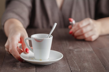 Empty cup of coffee with lipstick traces