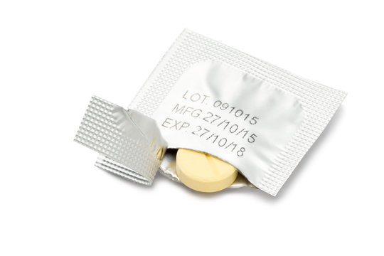 Tearing blister pack shown the pill and the data ( lot number, manufacturing date and expiry date )