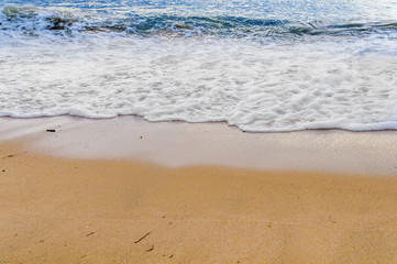 Fototapeta na wymiar Sea wave with sandy shore
