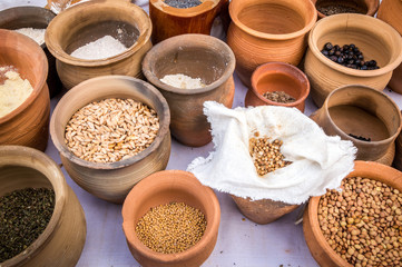 Slavic dry food products in an earthenware pots.