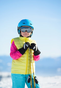 Skiing, winter fun, sport portrait of smiling skier girl