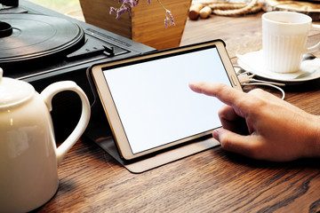 Tablet computer empty screen in man hands.