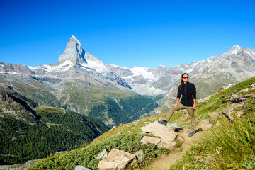 Fototapeta premium Matterhorn - Hiker in beautiful landscape of Zermatt, Switzerlan