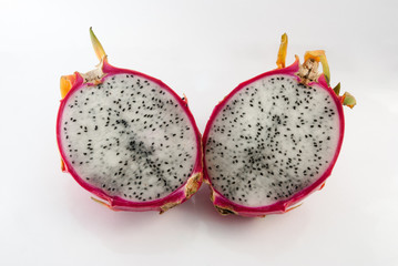 Dragon fruit cut in half on a white background closeup