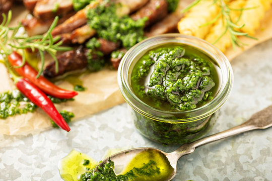 Green chimichurri sauce with grilled steak